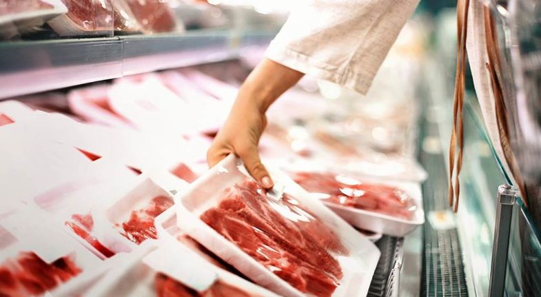 Buying-meat-at-a-supermarket-picture-id621271582